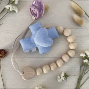 Doudou con forma de cruz y corazón